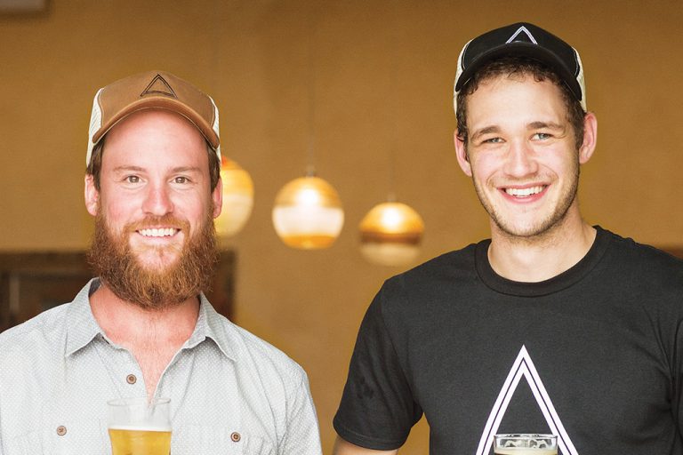 Two men from Angry Orchard Cindery smiling