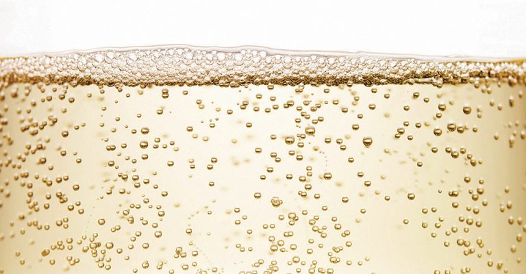 Sparkling wine bubbles close up