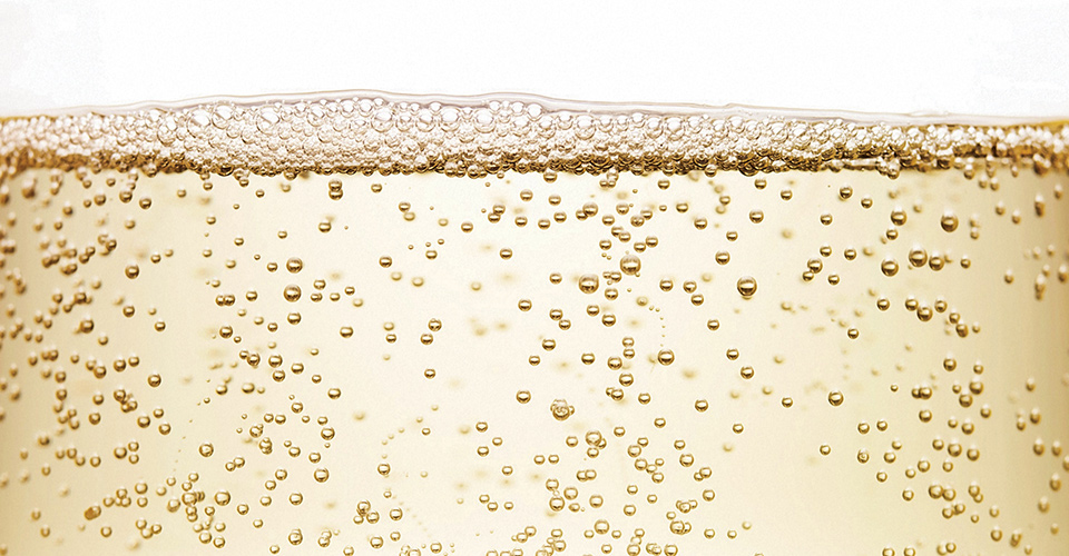 Sparkling wine bubbles close up