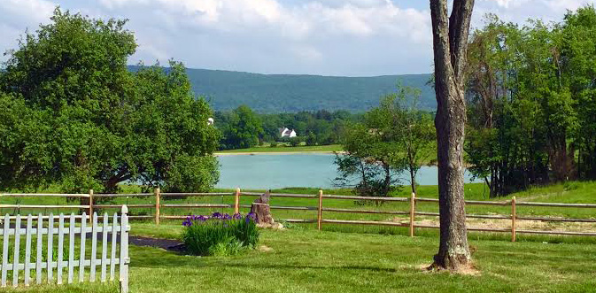 Landscape with lake in distance surrounded by hill range