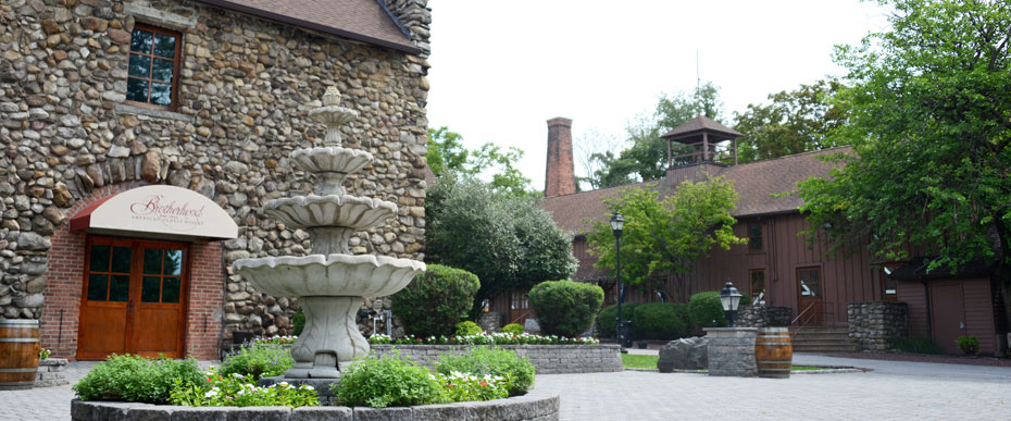 View of Brotherhood Winery grounds with fountain in foreground.