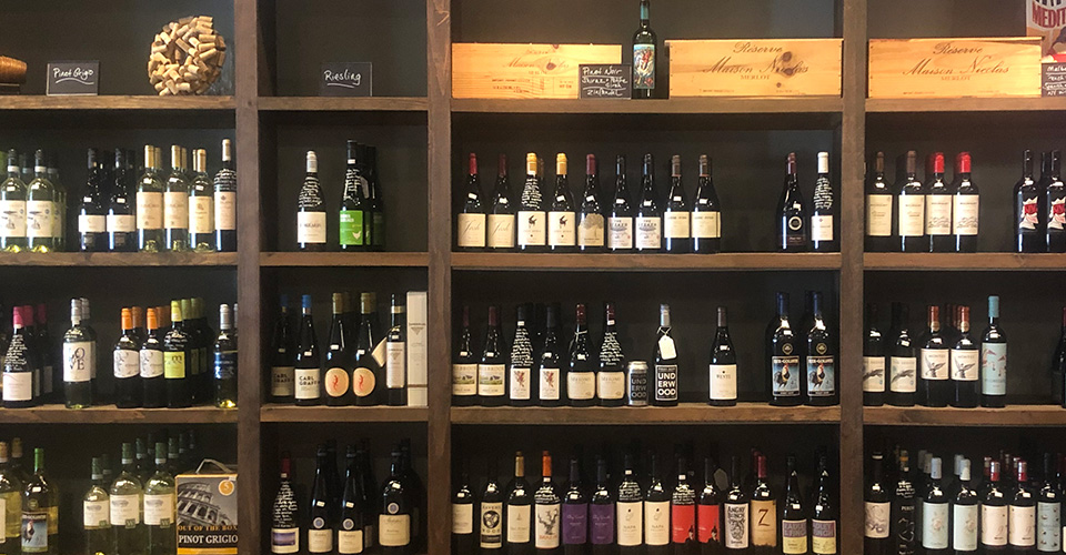 wall of wine bottles at a wiine shop