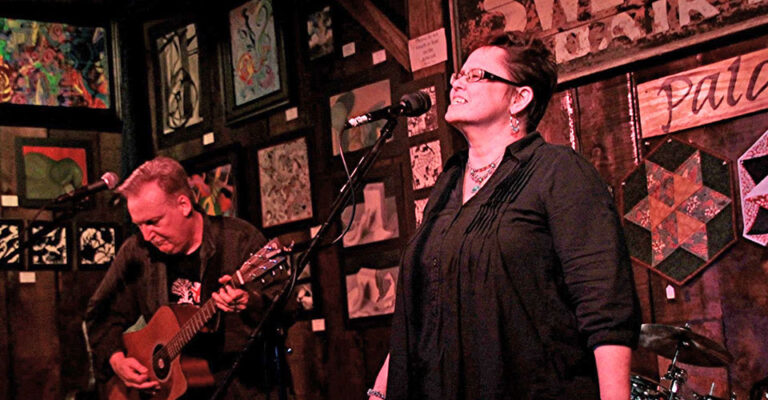 guitarist and singer on stage