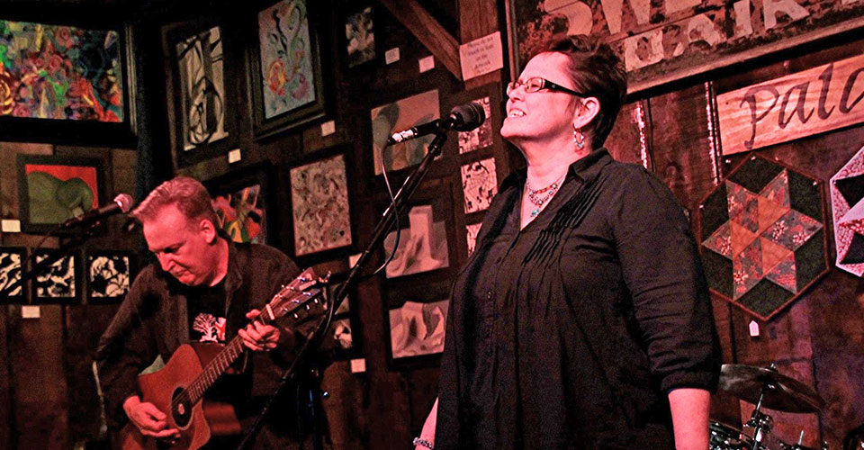 guitarist and singer on stage