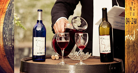 pourinh red wine from decanter