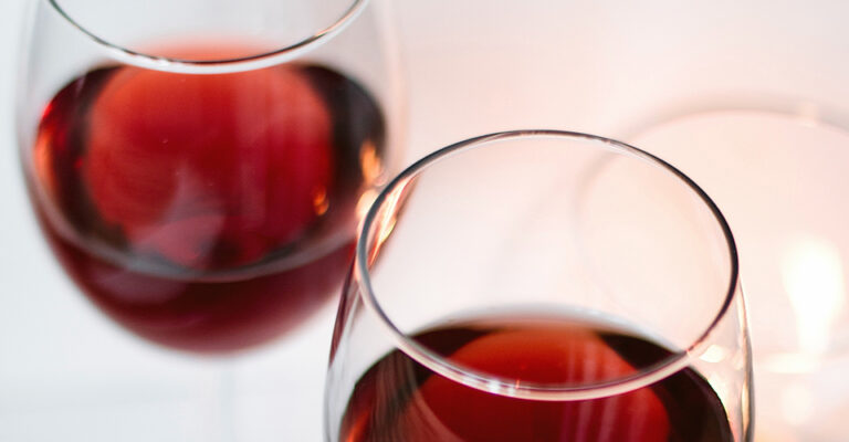closeup glasses of red wine