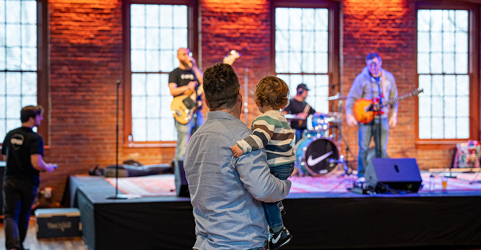 man and child looking at stage